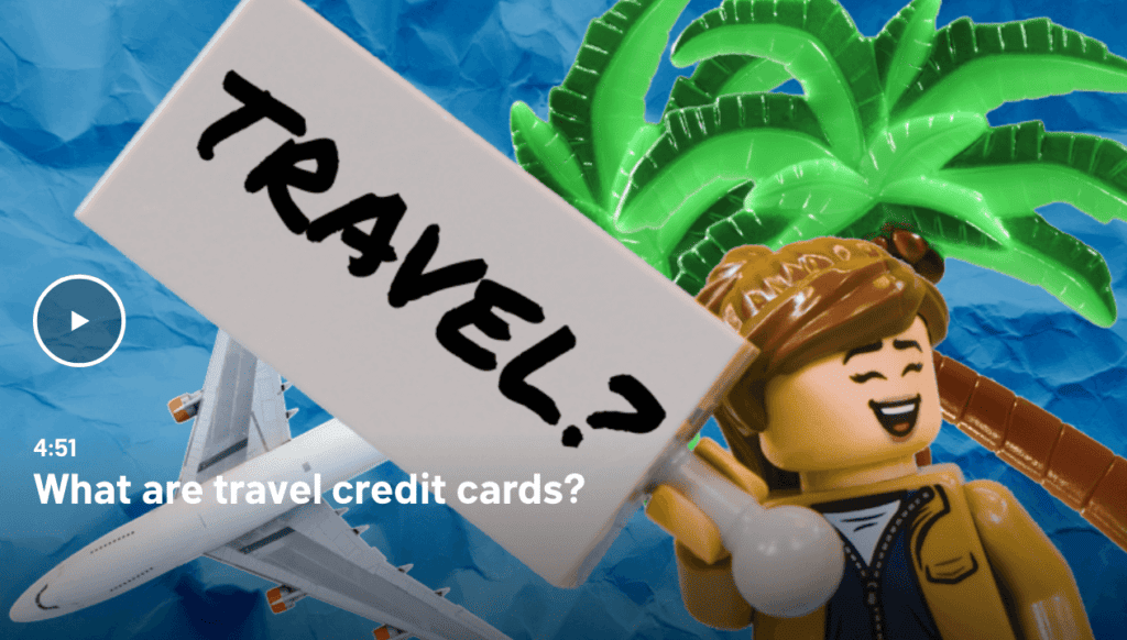 lego guy holding a travel sign