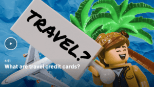 lego guy holding a travel sign